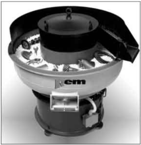 Figure 3: A 10 cubic foot vibratory bowl loaded with assorted commercial parts.